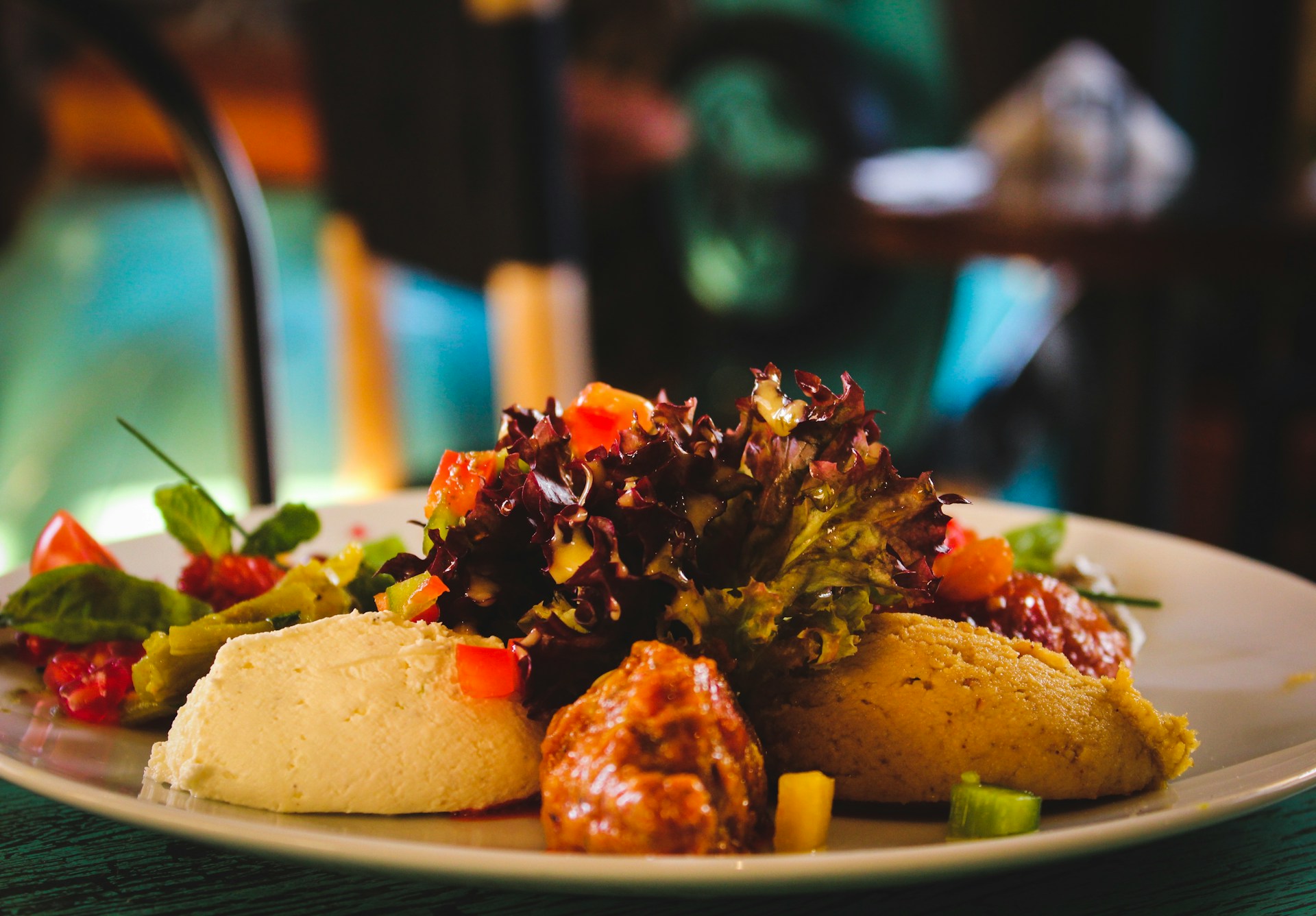 plate of cooked food with salad leaves